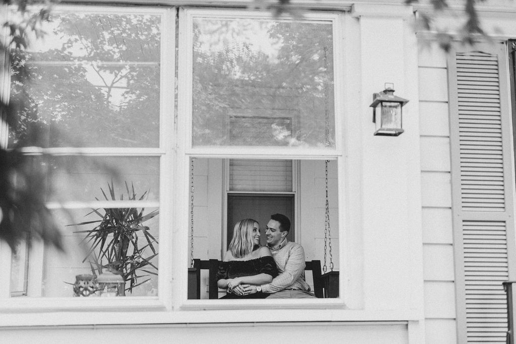 Black and white in home engagement session photo of couple in Collingswood NJ