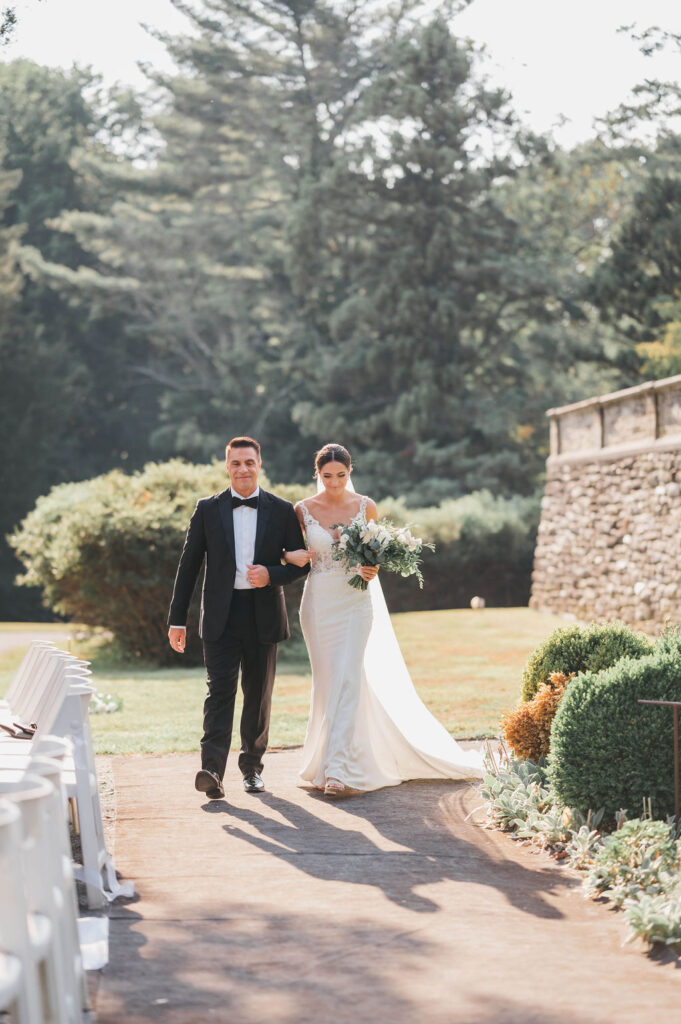 Father walking bride down the aisle at Greystone Hall wedding venue ceremony | Lauren E. Bliss Photography 