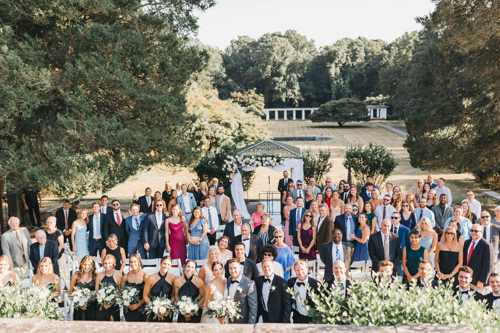 Wide shot of wedding guests in the North Garden ceremony location at Greystone Hall wedding venue in West Chester PA | Lauren E. Bliss Photography Luxury PA Wedding Photographer