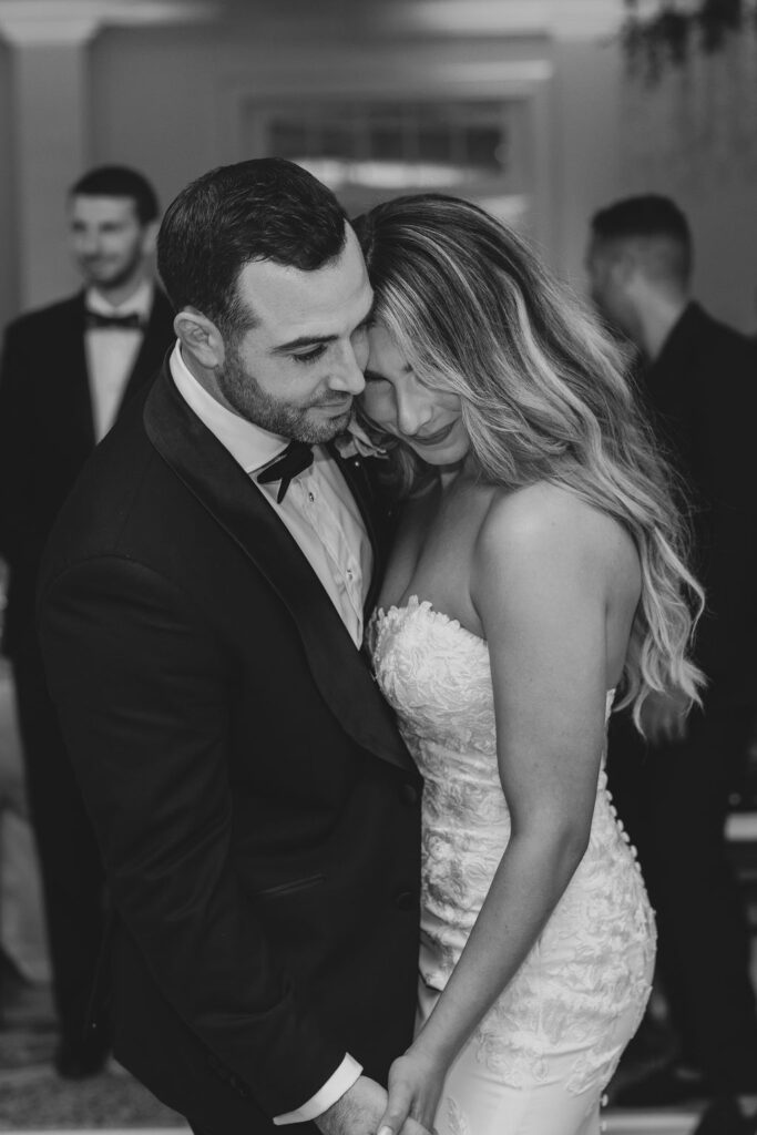 Bride and groom slow dance together at Hamilton Farm Golf Club wedding reception