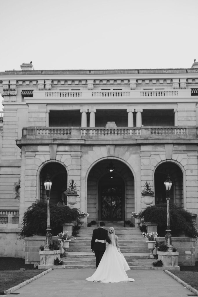 Bride and groom walk with arms around each other outside Elkins Estate wedding venue | Lauren Bliss Photography 