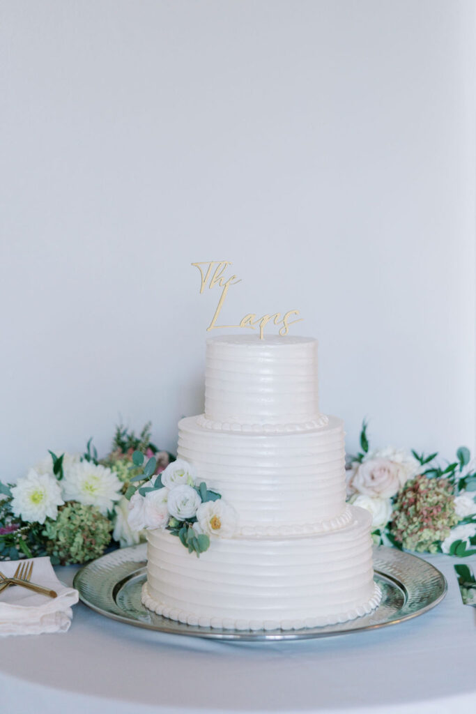 Simple three tiered white wedding cake