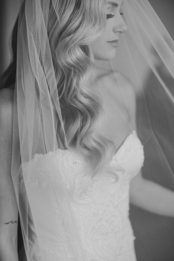 Bride looks down wearing veil over her face | Philadelphia Wedding at Waterworks Cescaphe by Lauren Bliss Photography