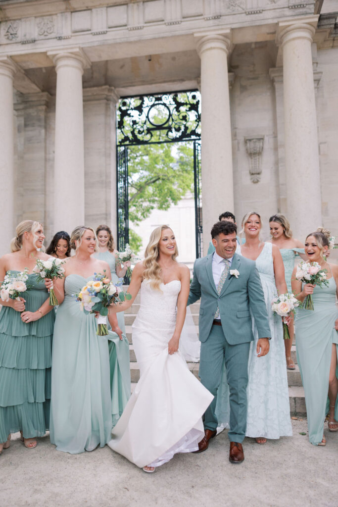 Wedding party dressed in sage green follows the bride | Philadelphia Wedding at Waterworks Cescaphe by Lauren Bliss Photography