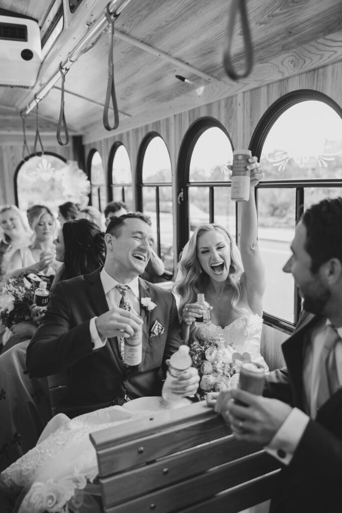 Bride and groom ride trolley transport with their wedding guests | Philadelphia Wedding at Waterworks Cescaphe by Lauren Bliss Photography