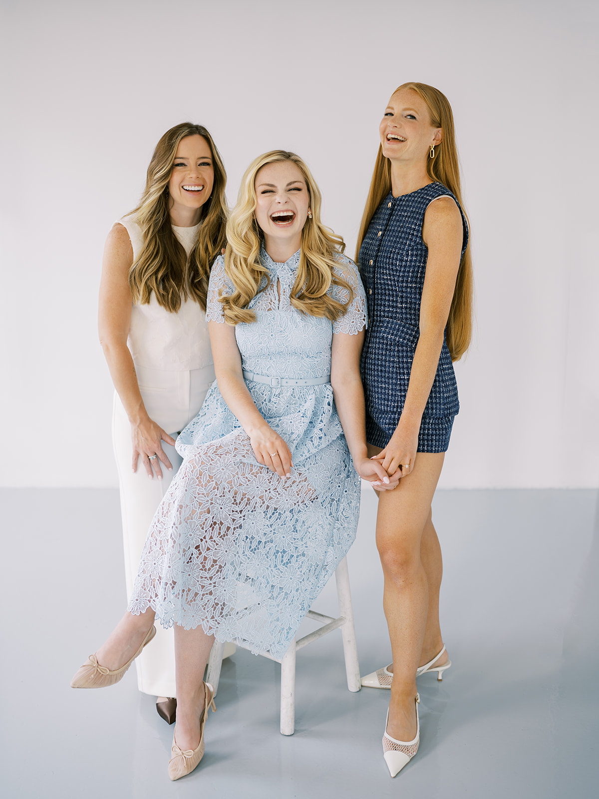 Natural, joyful photo of Lauren, Autumn, and Sarah laughing together during their branding session with Sophie Kaye Photography in NYC