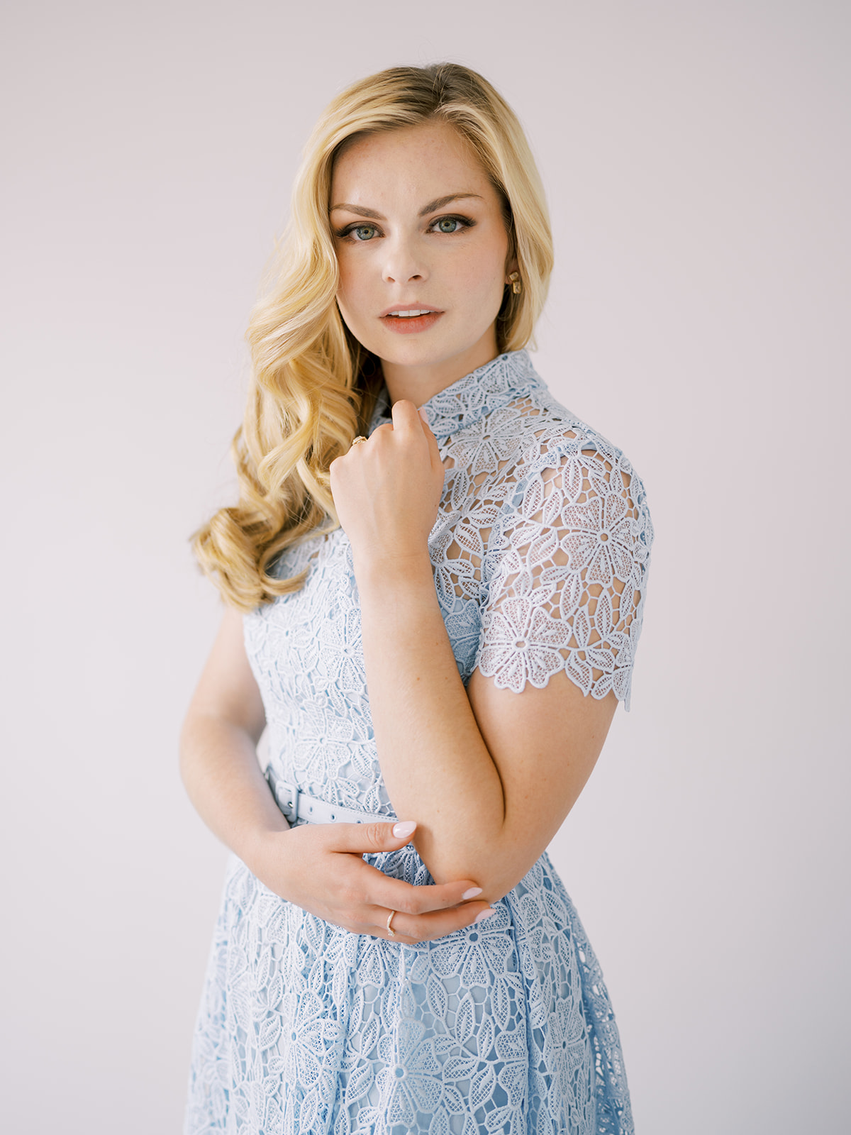 Elegant branding portrait of Lauren from the Lauren Bliss Photography associate team, captured in a white studio by Sophie Kaye Photography in NYC