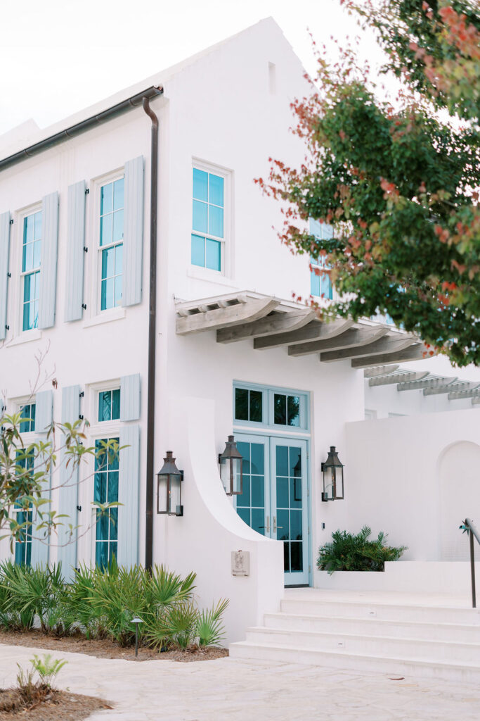 Clean architectural lines and blue shutters of an Alys Beach residence, perfect for lifestyle portraits and luxury coastal event photography.
