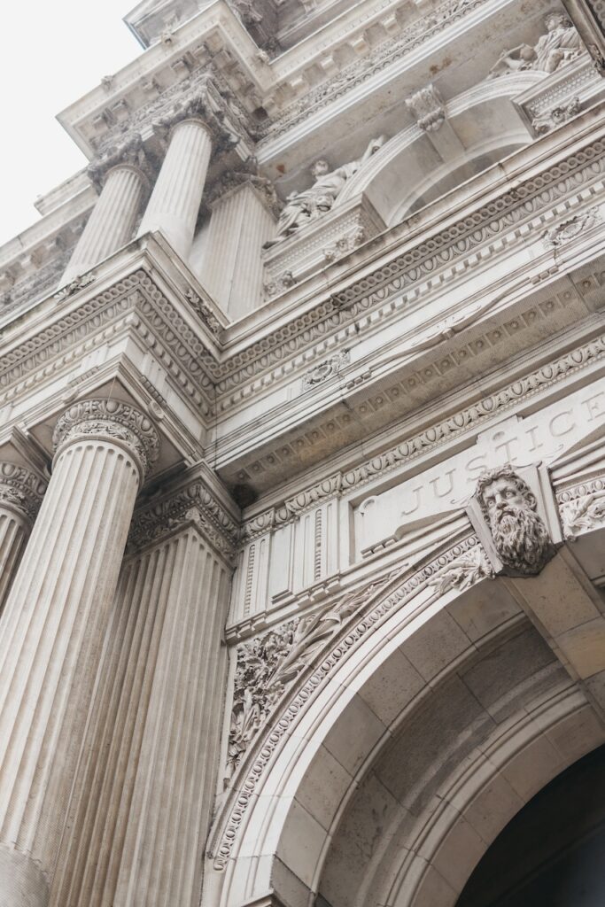 Detailed view of Philadelphia City Hall’s ornate columns, carvings, and stone architecture, captured as a wedding portrait location by Lauren Bliss Photography.
