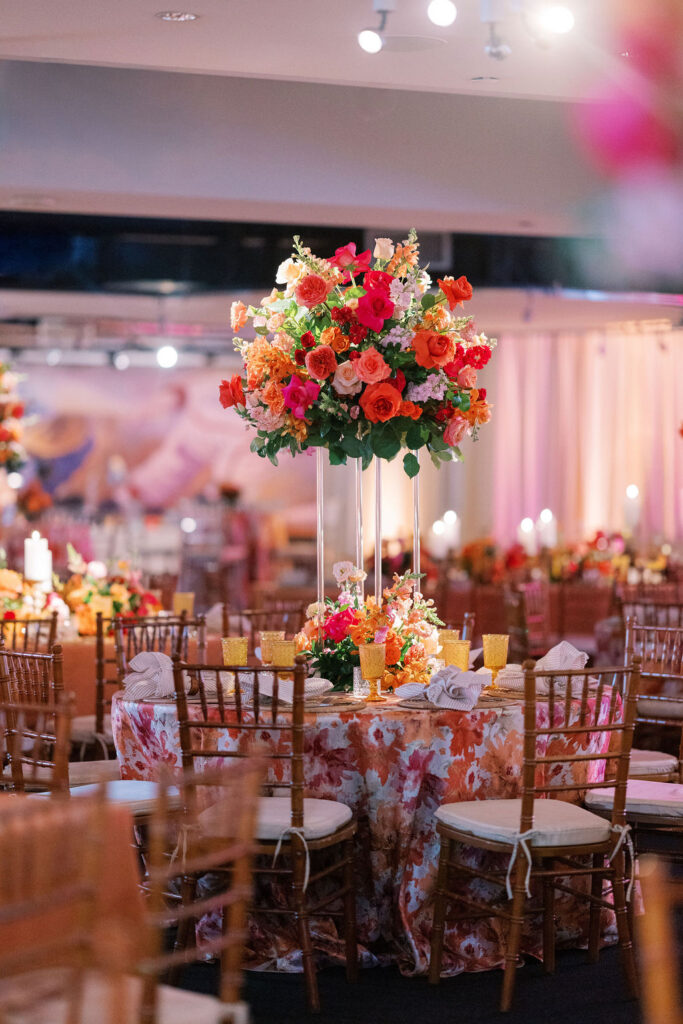Wedding reception tables with tropical florals at the CP Rankin Club at Citizens Bank Park